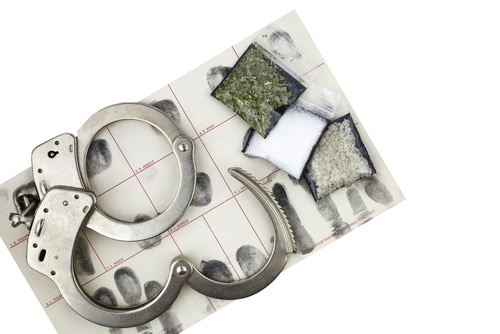 Drug,Bust,Arrest,With,Handcuffs,,Fingerprint,Id,,And,Fake,Sample - Nassau County Drug Crime Lawyer | New York Criminal Defense Attorney